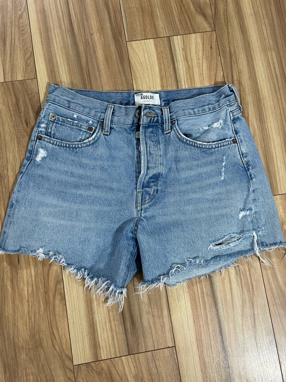 AGOLDE Parker Long Blue Distressed Denim Raw Hem Jean Shorts.